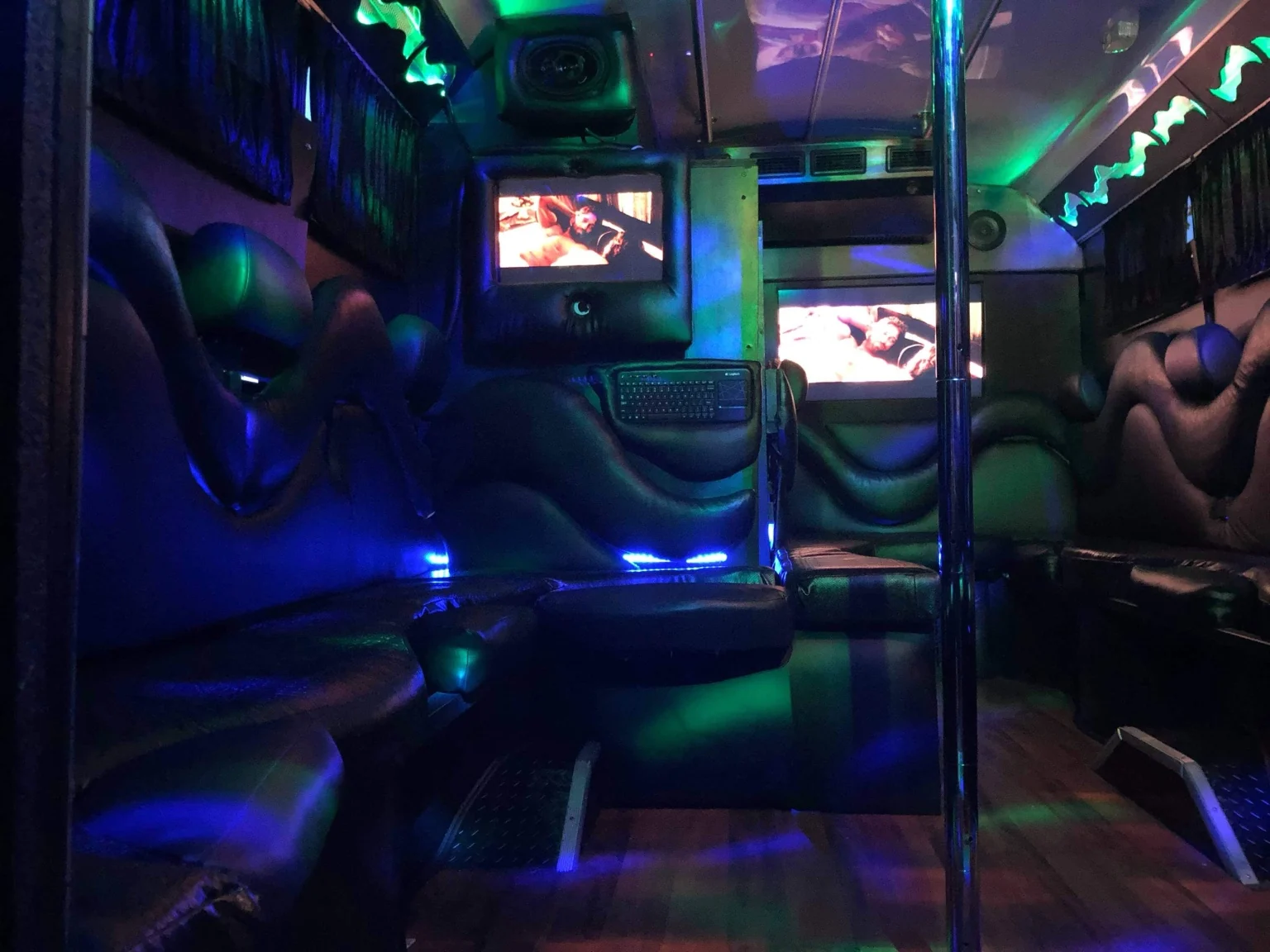 Streamer Bus seating, screens and dance pole